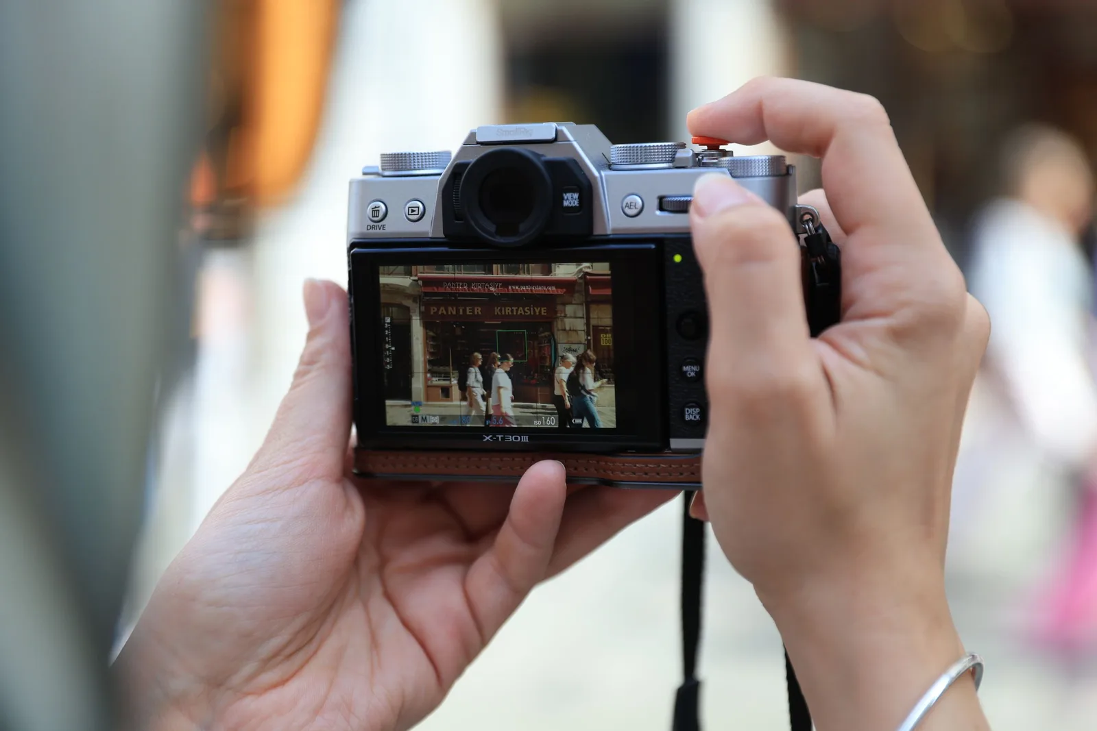 Photographer holding a camera to capture an interior room for a property listing. Photo by Furkan  Aktaş on Pexels