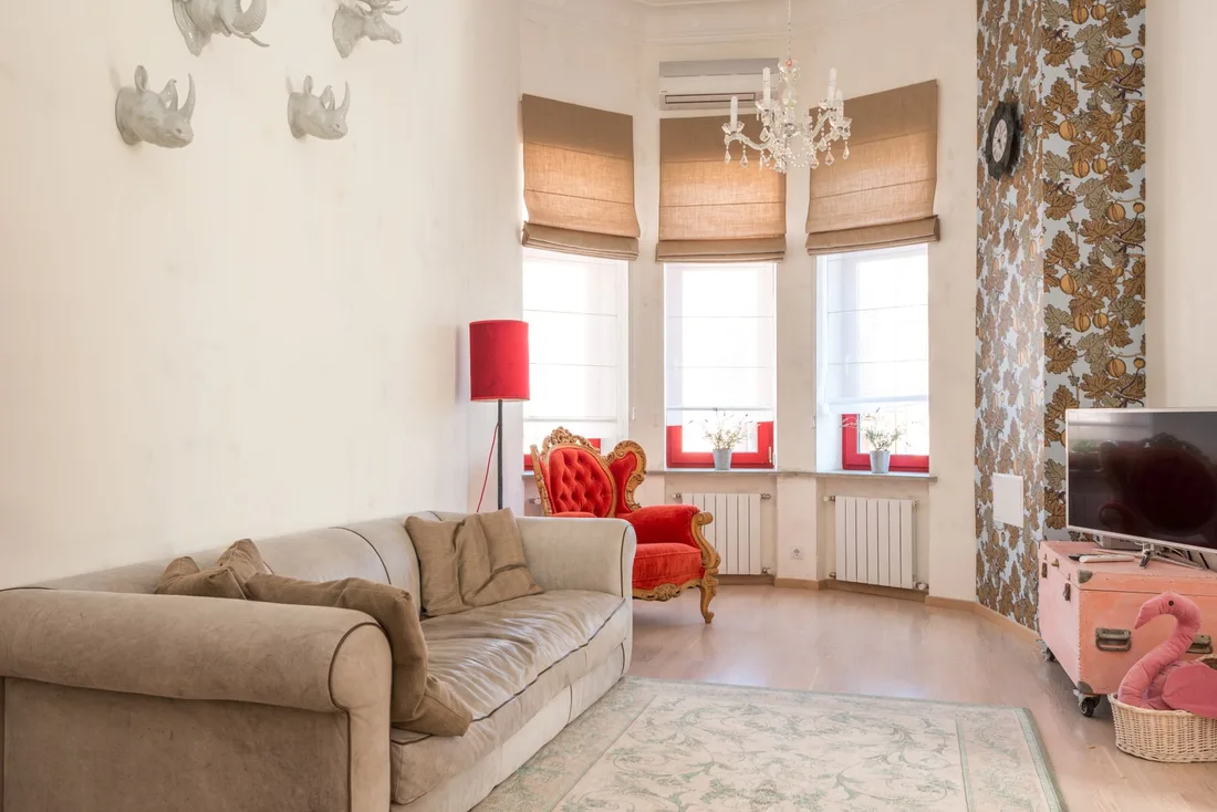 Bright, tidy living room with beige sofa, large windows and warm natural light. Photo by Max Vakhtbovych on Pexels
