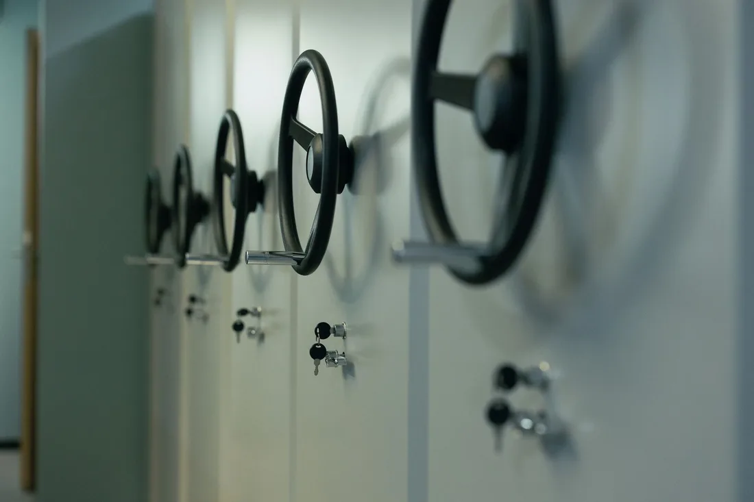 Row of heavy vault doors with locking wheel handles in a storage room. Photo by cottonbro studio on Pexels
