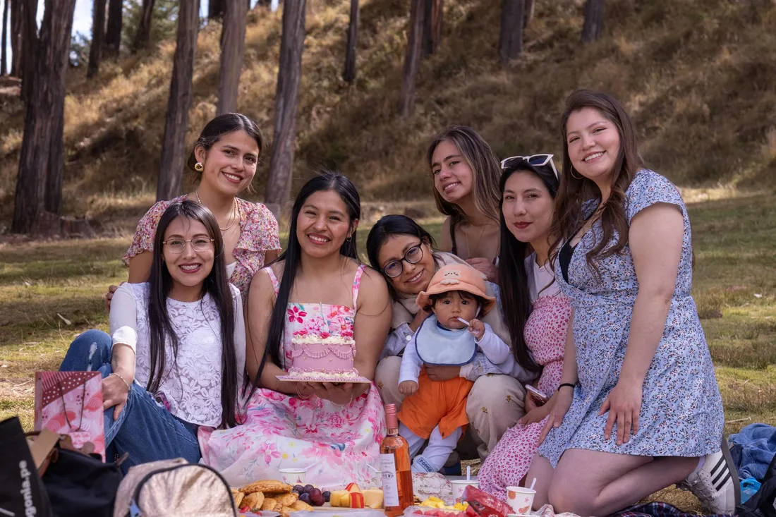 Group of friends and family enjoying a picnic together in a pine forest. Photo by Dulce Panebra on Pexels