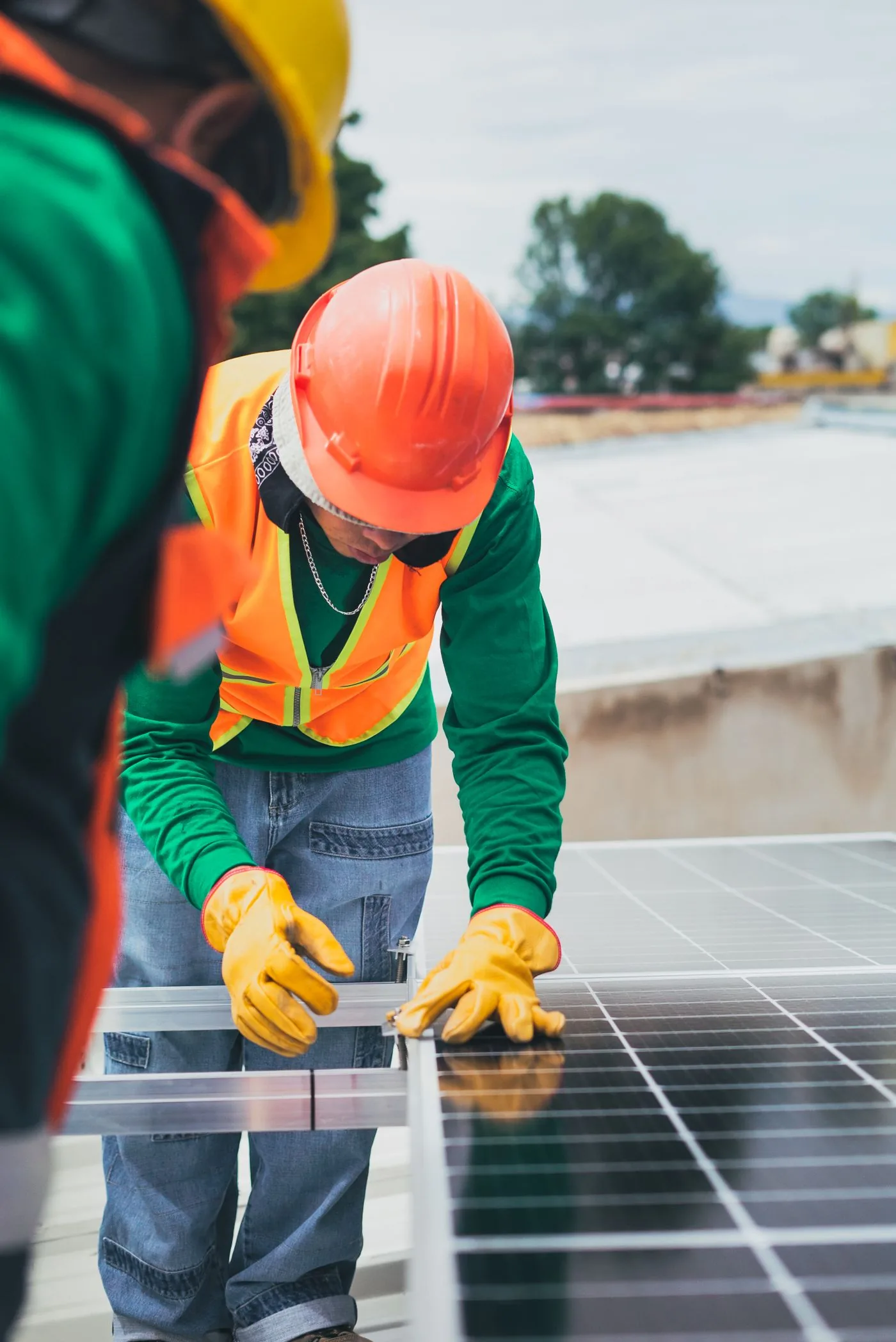 Energy Audits and Efficiency — Solar installation crew positioning panels on a commercial roof. Photo by Los Muertos Crew on Pexels
