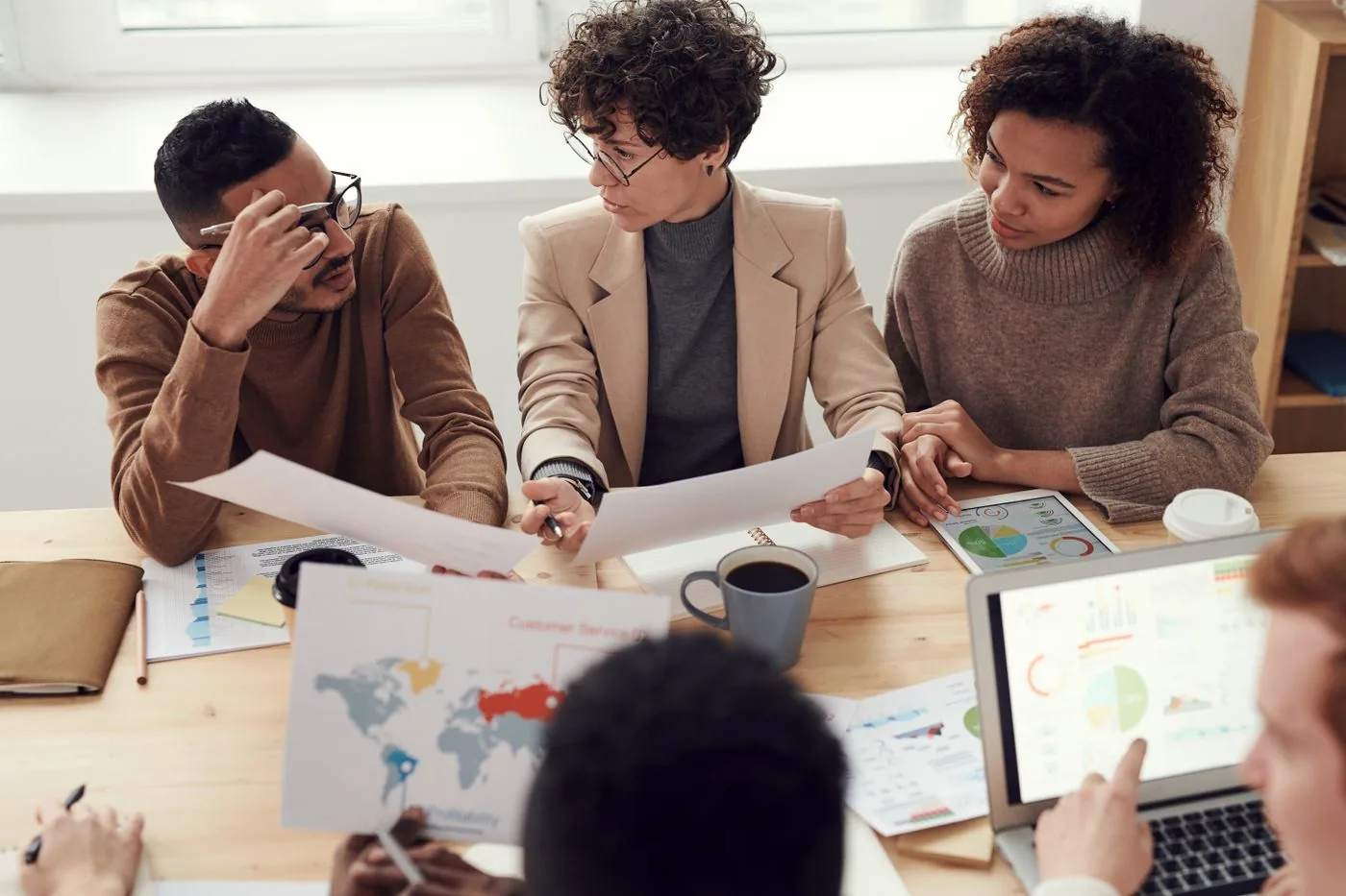 Team mapping CRM pipeline stages and lead handoffs. Photo by fauxels on Pexels