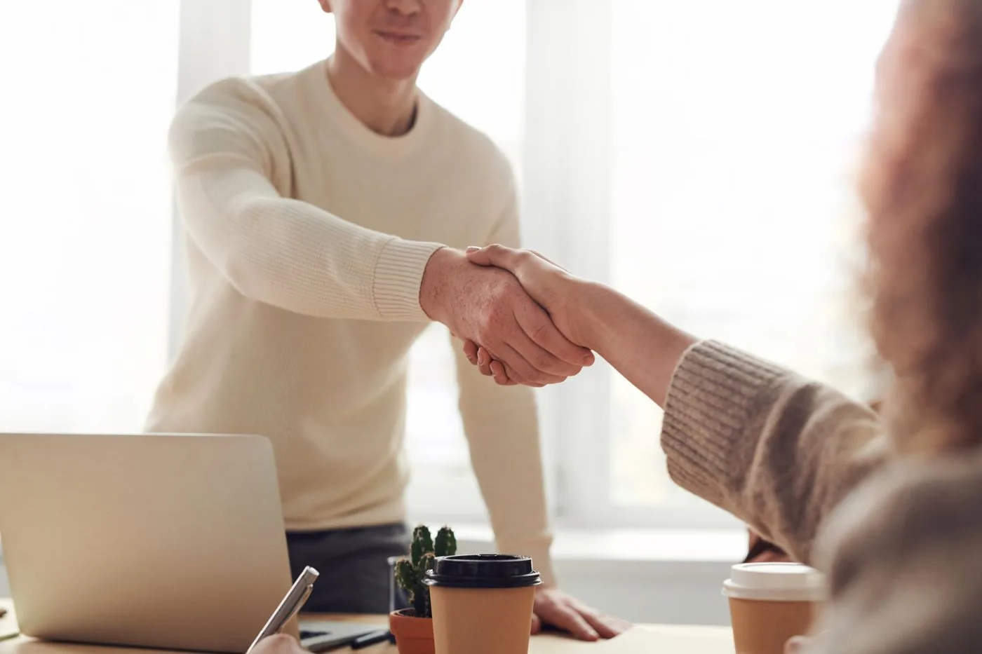 Business handshake representing off-page authority and partnerships. Photo by fauxels on Pexels